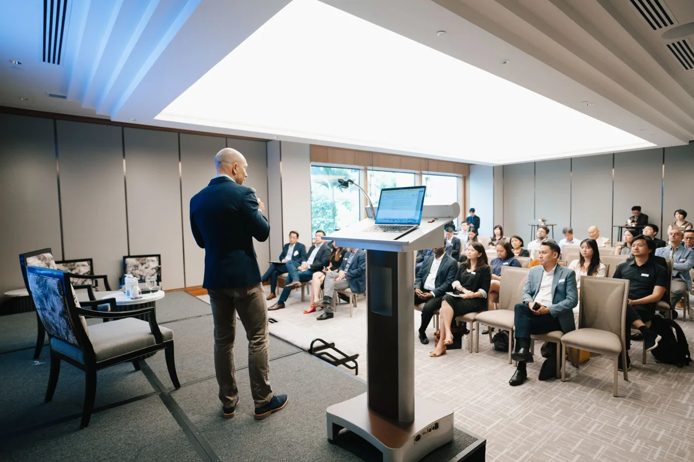 Jonah Larkin speaking to a room of executives