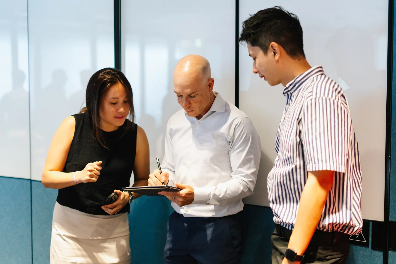Jonah Larkin working through a problem with two founders
